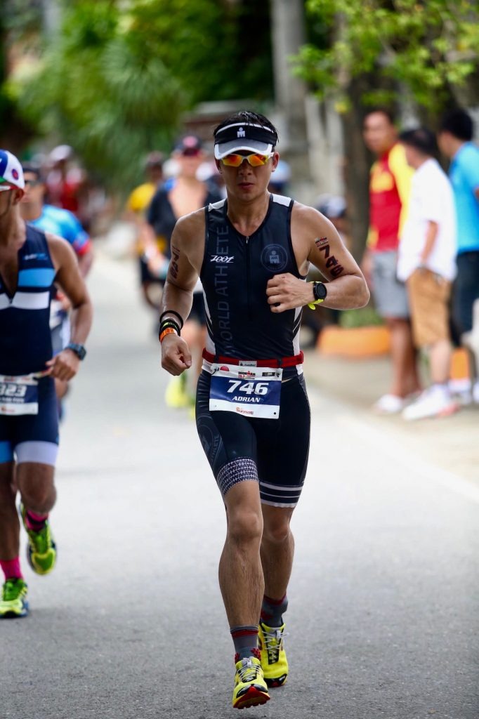 Adrian Li running in Ironman race